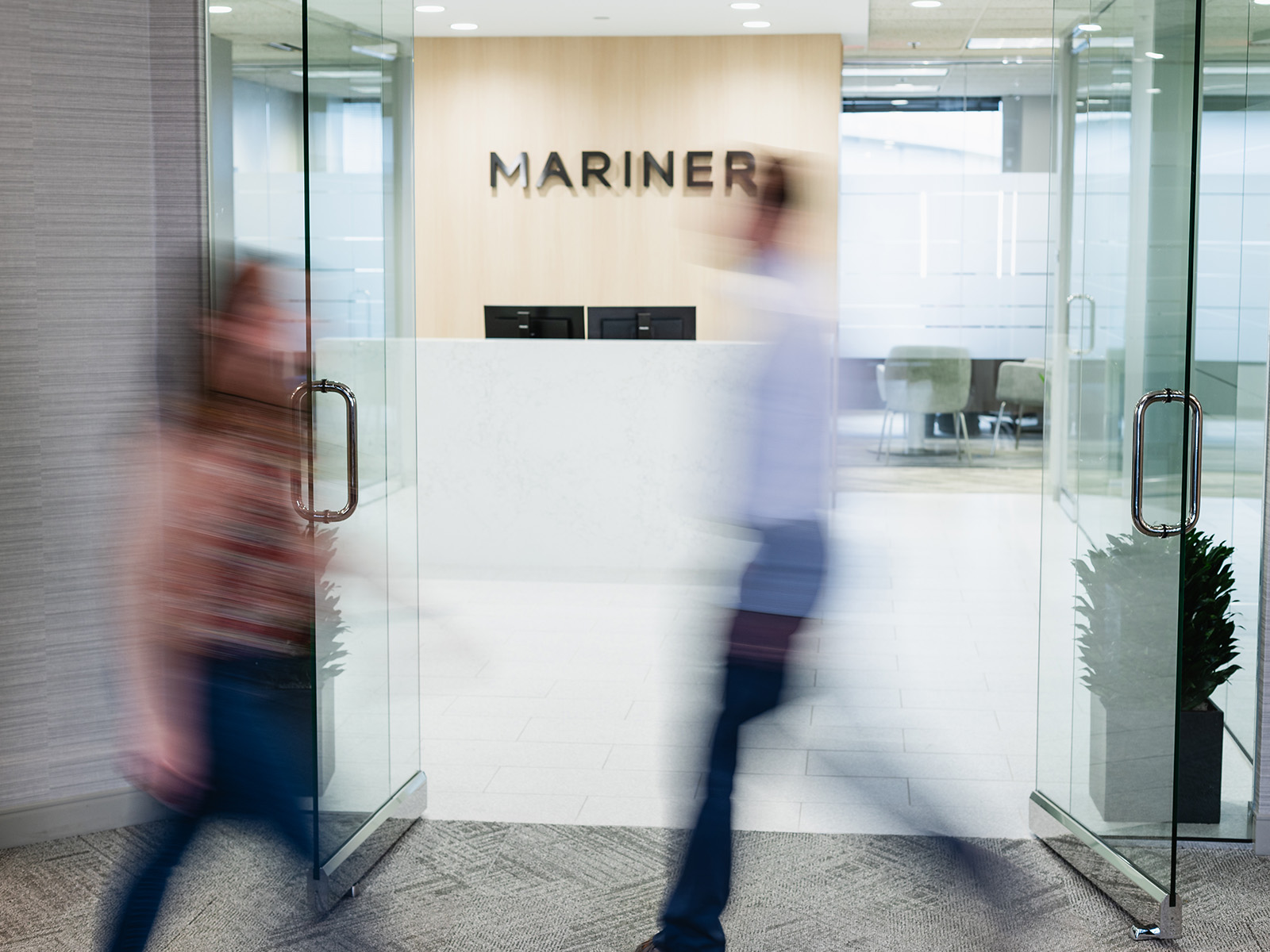 Businesspeople walking in Mariner office